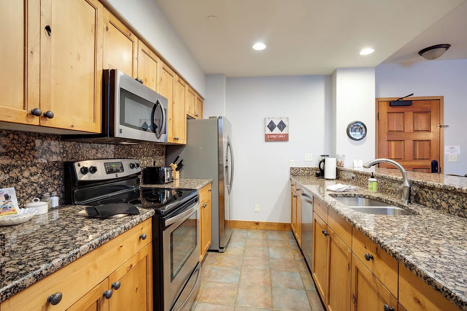 Your fully equipped kitchen features granite countertops, stainless steel appliances, and everything you need to prepare memorable meals during your stay.