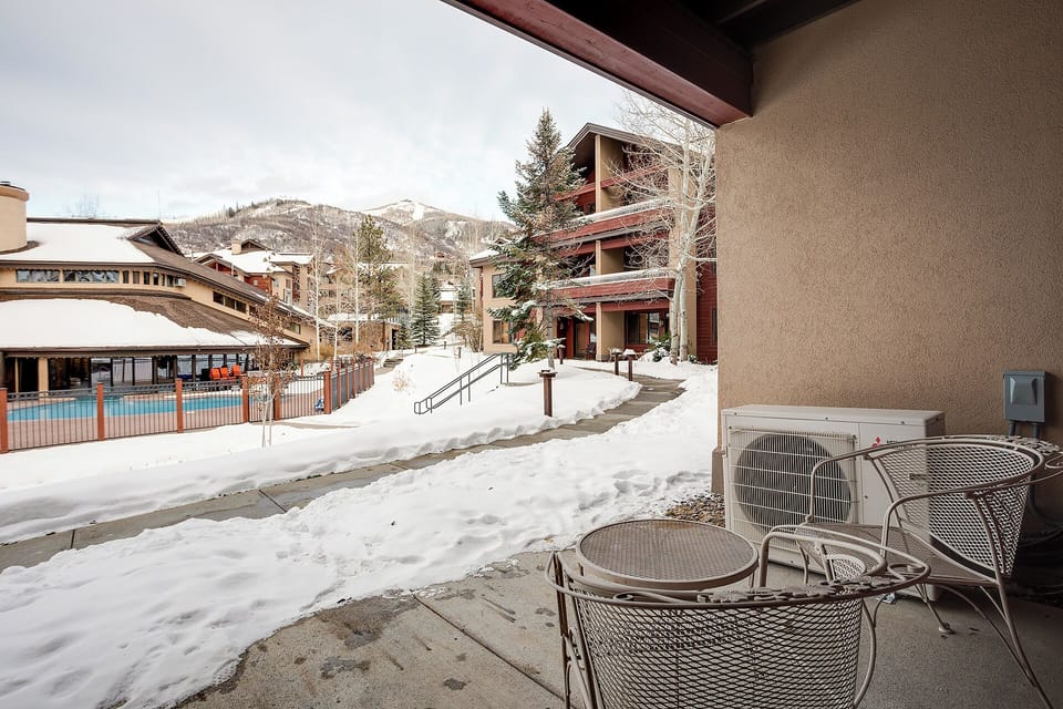 Step onto your private terrace and soak in stunning mountain views, with a refreshing pool just steps away and alpine peaks creating the perfect winter backdrop for your getaway.