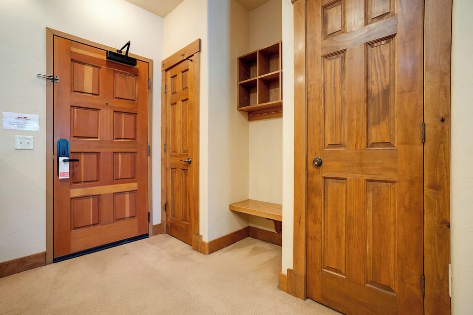 Step into your welcoming entryway, where warm wood tones and thoughtful built-ins make you feel right at home the moment you arrive.