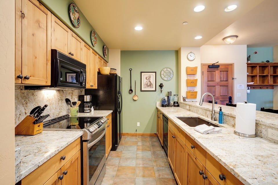 Your fully-equipped kitchen features granite counters, modern appliances, and charming rustic cabinets—perfect for preparing your favorite meals or morning coffee during your stay.