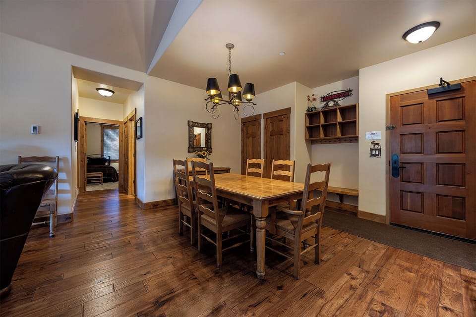 Step into your cozy dining space with warm wood floors and rustic furnishings that invite you to gather for meals and make memories together.