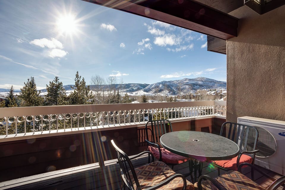 Private balcony offering sweeping views of snow-capped mountains, perfect for morning coffee or evening relaxation surrounded by scenic alpine beauty.