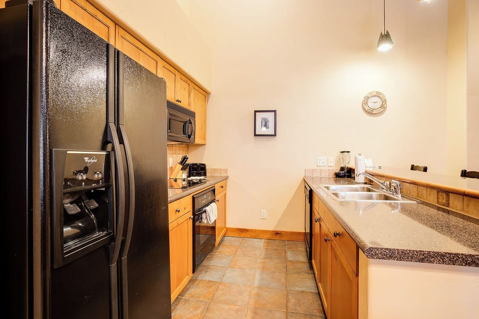 Your fully equipped galley kitchen features modern appliances and plenty of counter space for preparing favorite meals during your stay.