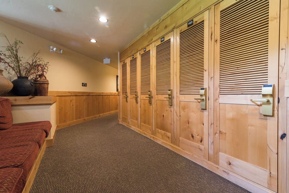 Secure your belongings in these spacious wooden lockers, conveniently located in a warm, well-lit common area with comfortable seating for your convenience.