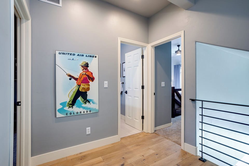 Your private upstairs hallway connects all the bedrooms with vintage Colorado charm and plenty of natural light flowing through.