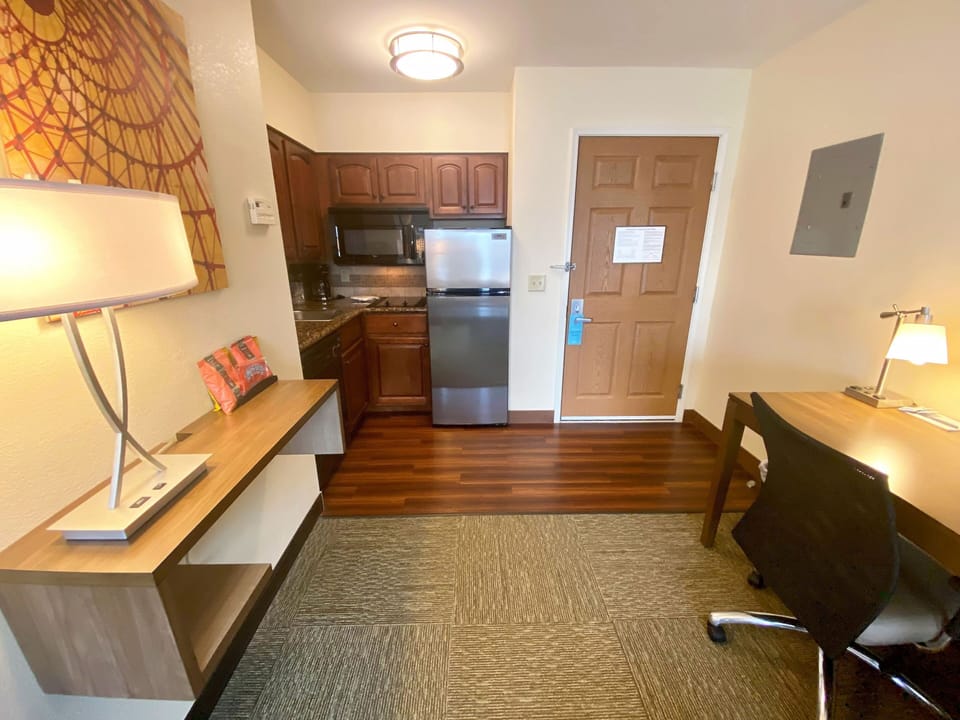 Prepare meals effortlessly in this well-equipped kitchen, just steps from your workspace.