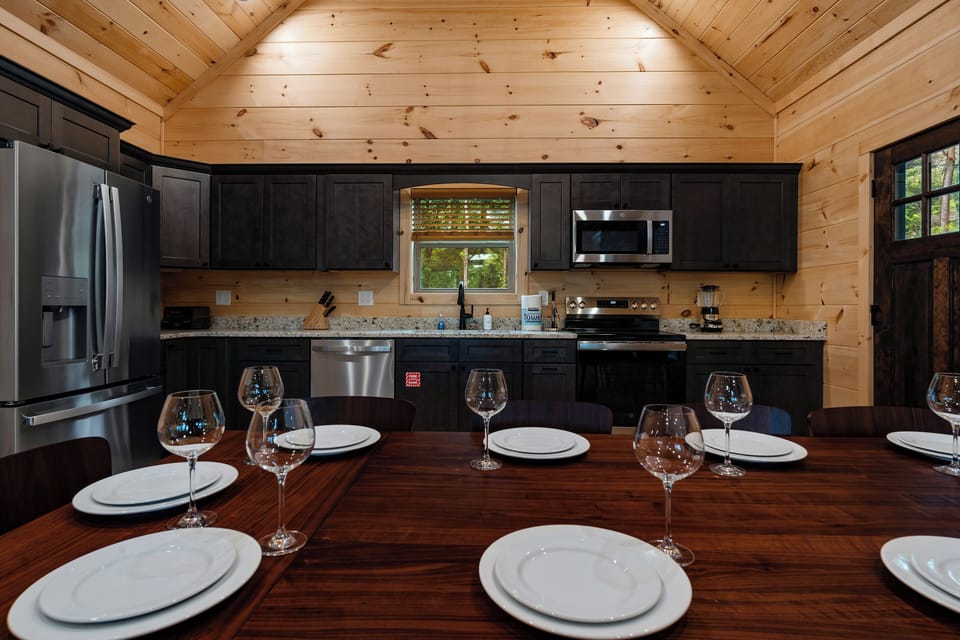 The fully equipped kitchen makes group meals easy, with granite countertops, stainless appliances, and dining space for the whole crew.