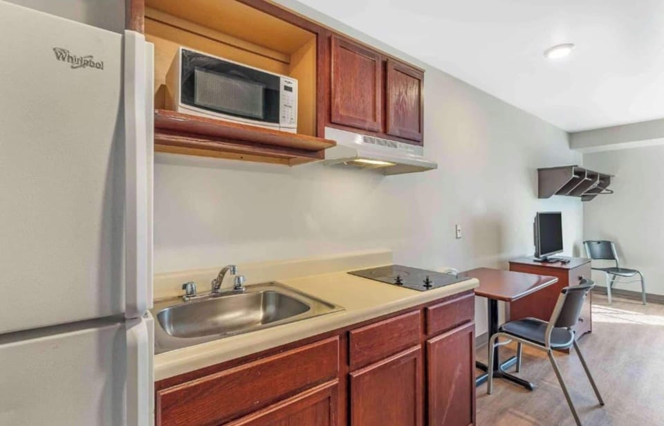 Room, 2 Queen Beds, Non Smoking, Kitchen | Private kitchenette | Full-size fridge, microwave, stovetop, freezer