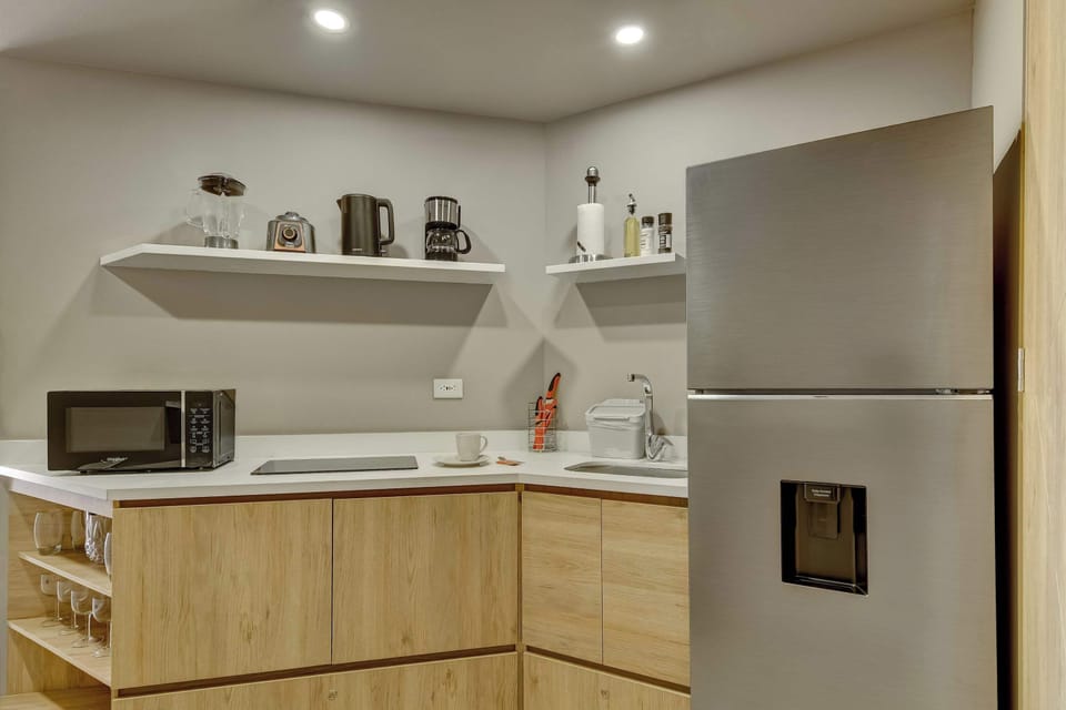Fully equipped kitchen with modern appliances and ample storage.