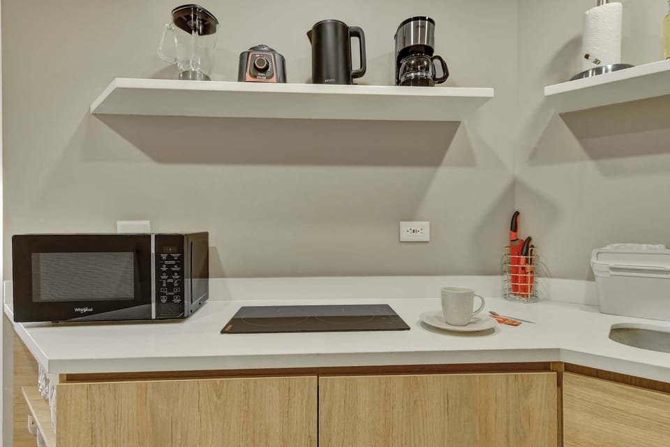 Modern kitchenette equipped for convenient stays.
