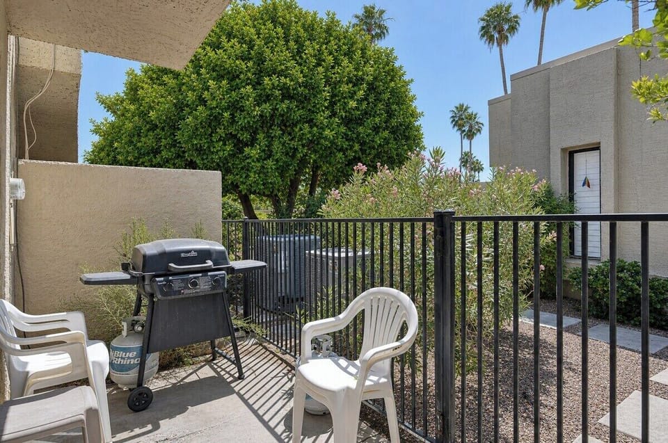 Fire up the grill on your private patio, where palm trees sway and sunshine invites you to relax outdoors with a cold drink in hand.