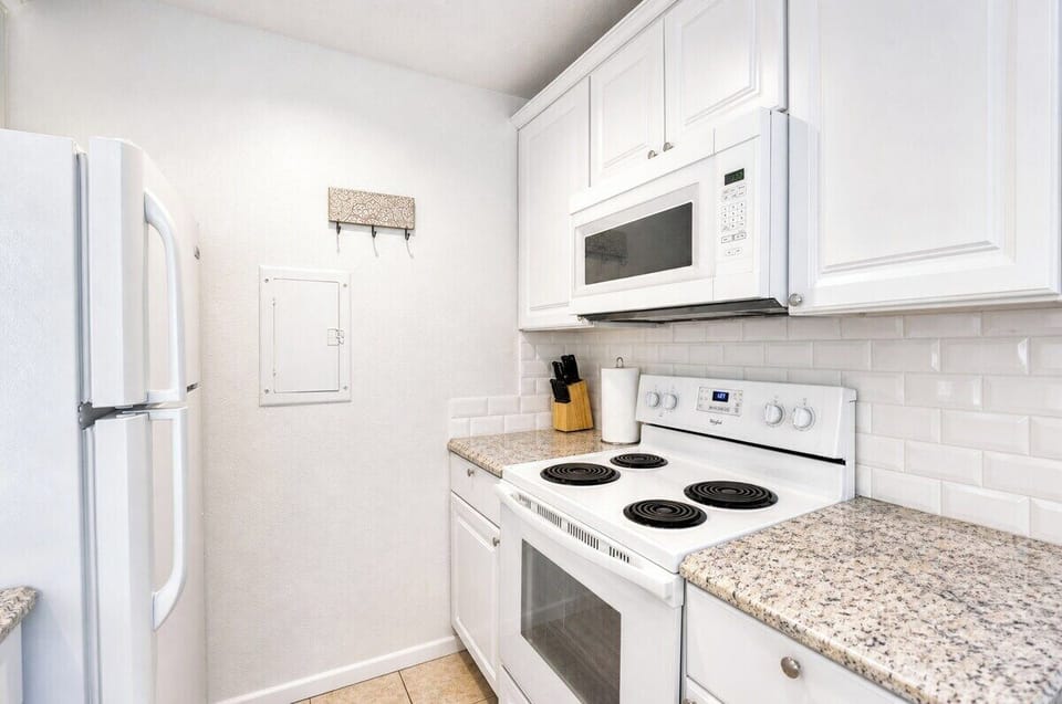 Your fully equipped kitchen features modern appliances and a bright, clean space perfect for preparing meals during your stay.