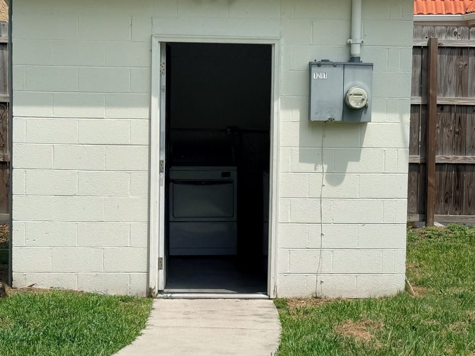 Private outdoor laundry room with convenient in-unit washer and dryer