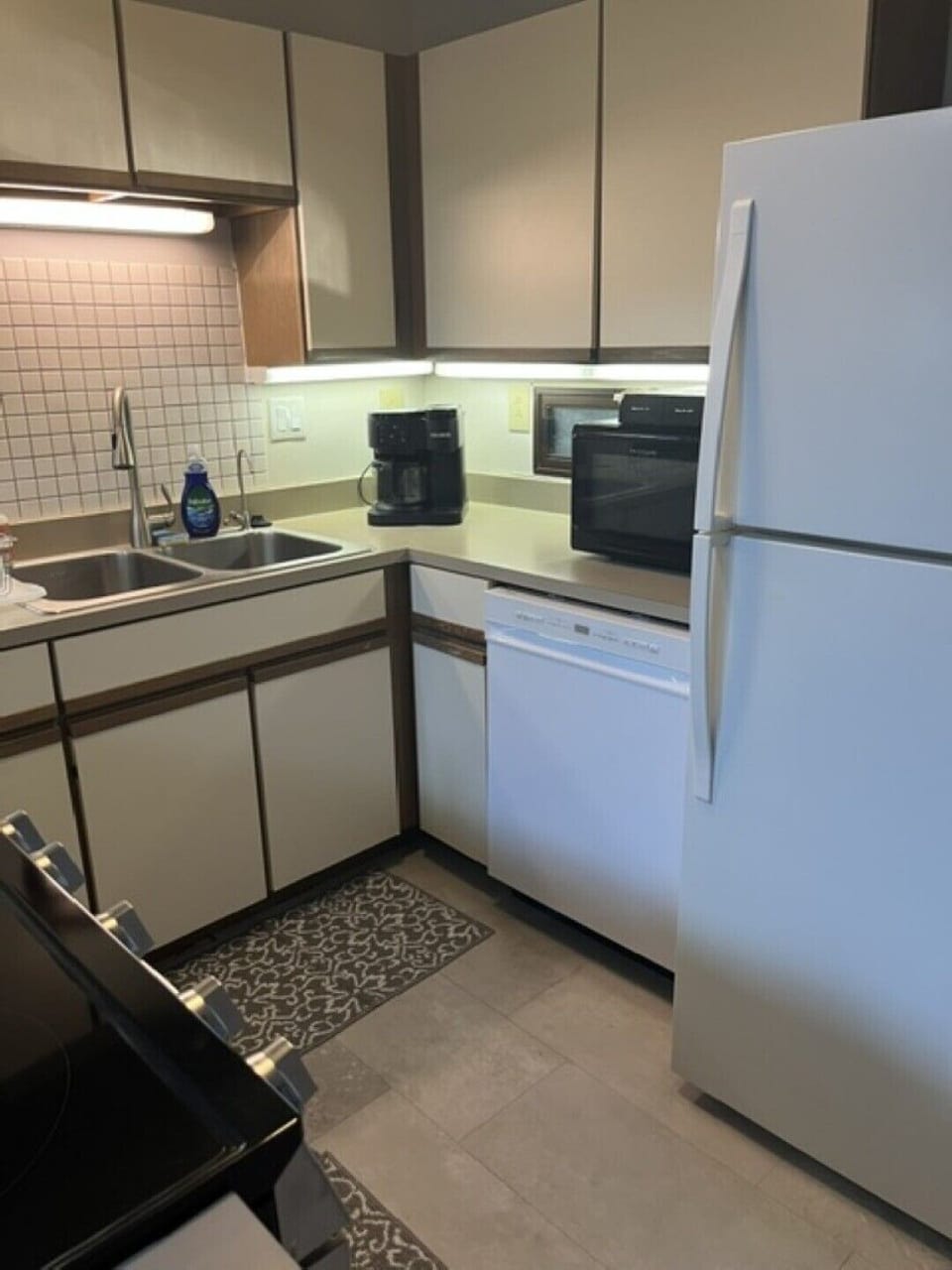 Kitchen with New Dishwasher and Coffee Machine