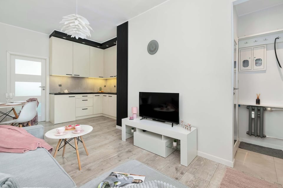The living room's modern and stylish decor creates a welcoming atmosphere.