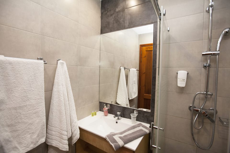 Shower, free toiletries, hair dryer, slippers