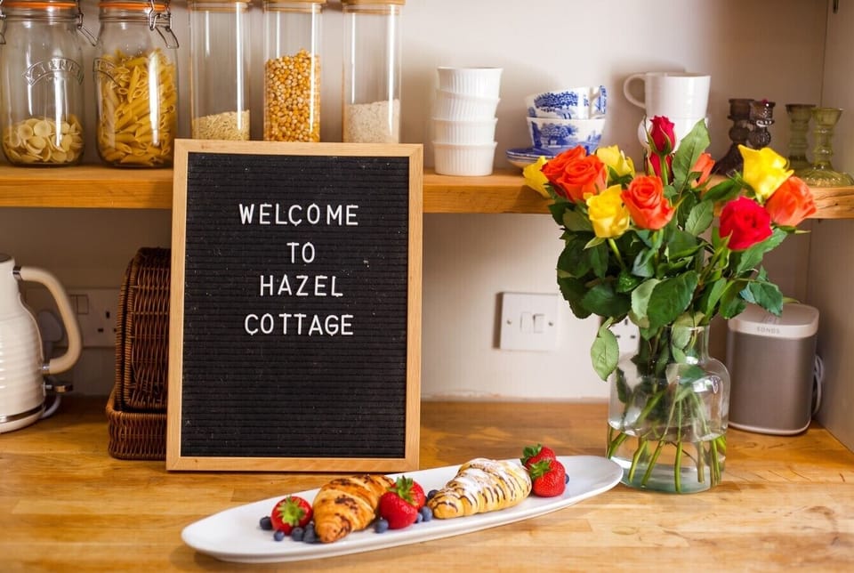 Arrive to fresh pastries and bright roses at Hazel Cottage