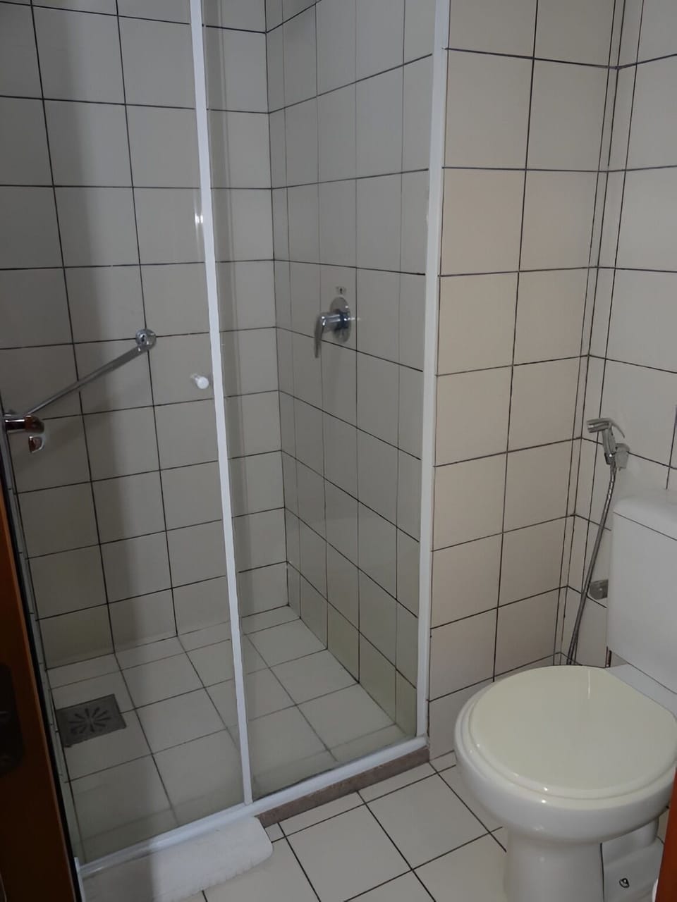 Rinse off comfortably in a simple, practical walk-in shower.