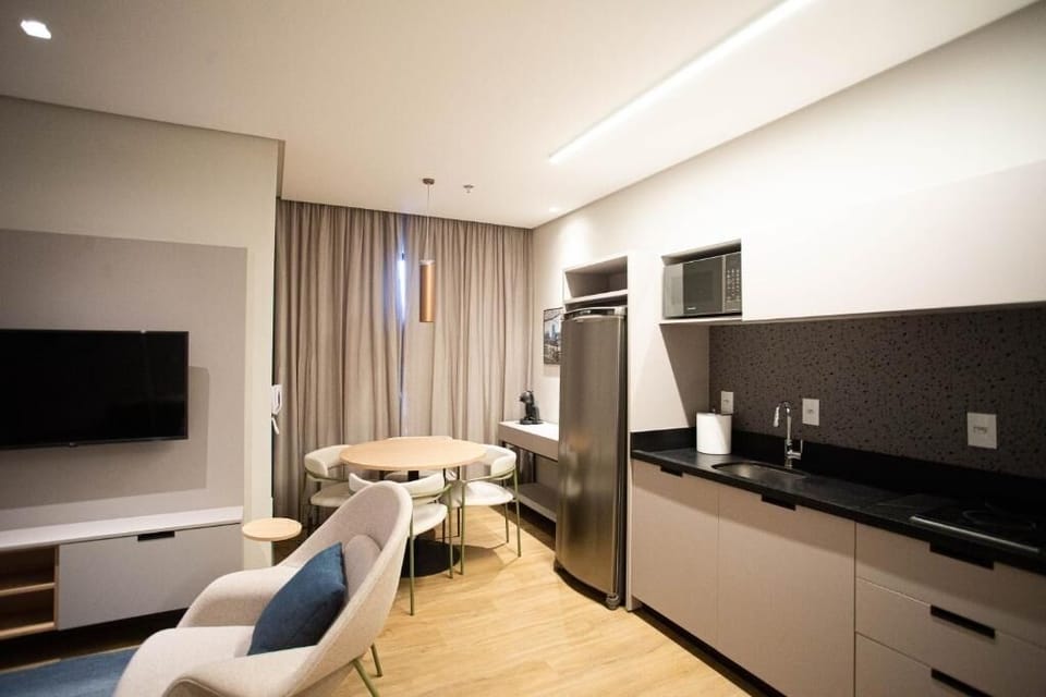 Cook and dine effortlessly with sleek appliances and cozy seating.