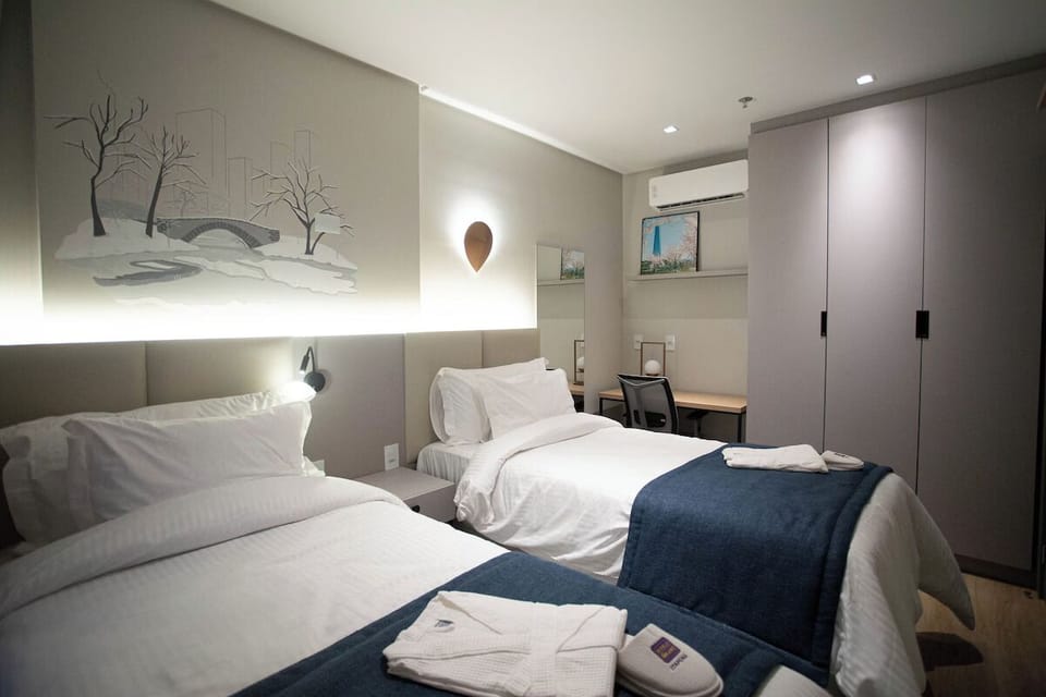 Recharge in a calming bedroom with workspace and generous storage.