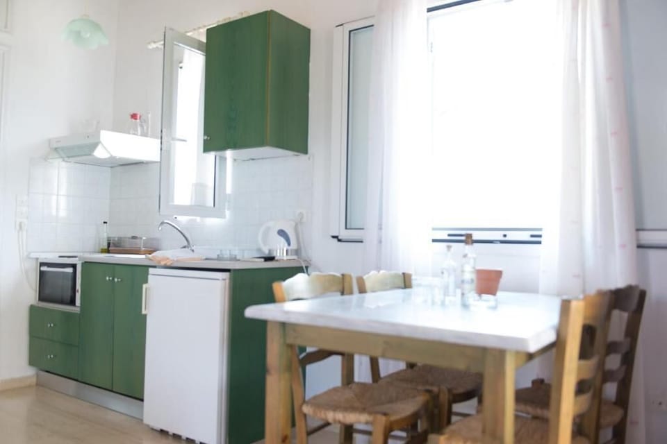 Charming kitchen and dining space filled with natural light