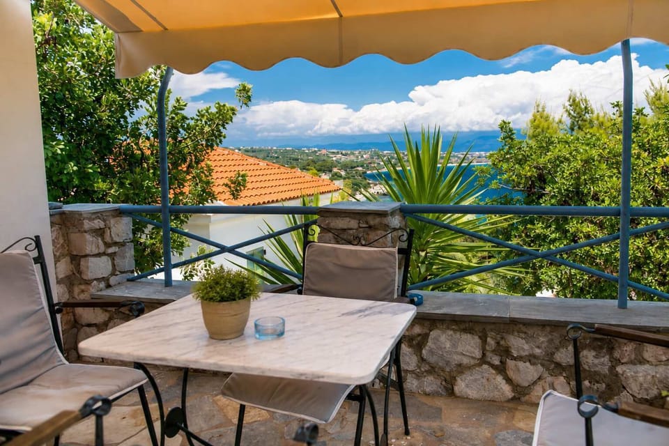 Shaded outdoor dining area with beautiful views of the sea