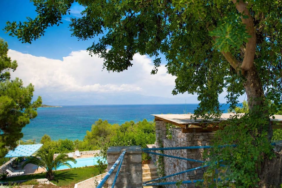 Peaceful balcony with beautiful views through the trees towards the Messinian Gulf.