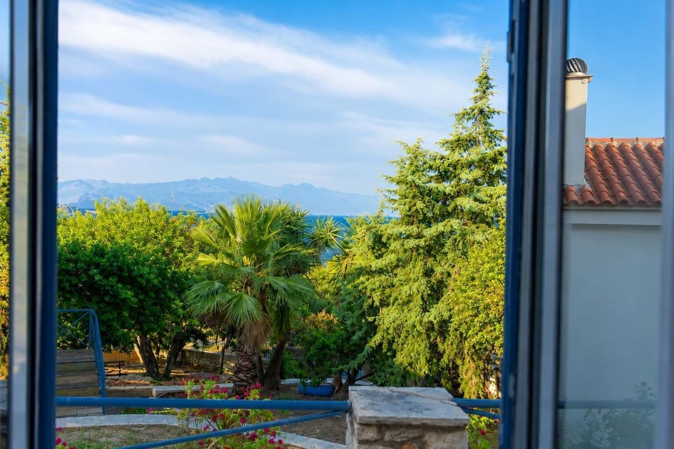 Balcony surrounded by greenery, offering a peaceful spot to relax and enjoy the natural surroundings.