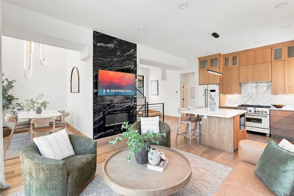 Tons of natural light in this living room, along with high-end furnishings. Smart TV with all the apps you could want and a gas fireplace.