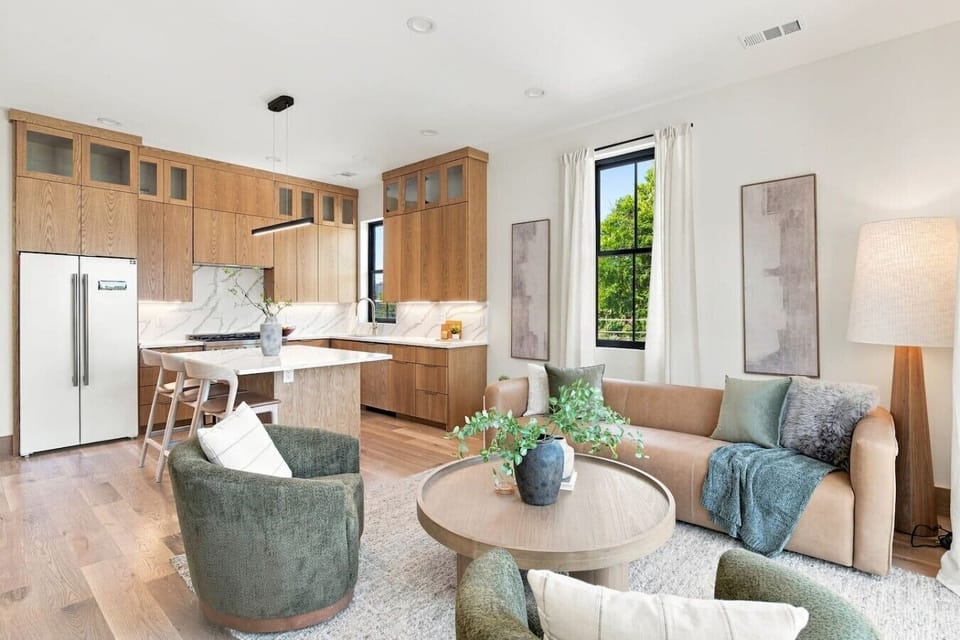 Tons of natural light in this living room, along with high-end furnishings. Smart TV with all the apps you could want and a gas fireplace.