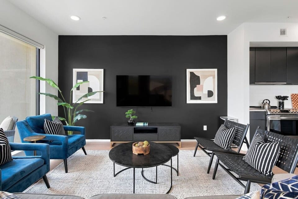Spacious living room with queen pull-out couch, stunning riverfront views, and a Smart TV for your entertainment. Enjoy your morning coffee on our private patio that overlooks Cumberland river.