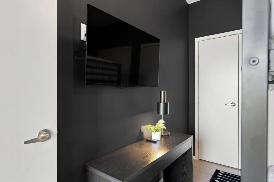 Bedroom 2 consists of a queen-over-queen bunk bed, two spacious closets, and smart TV.
