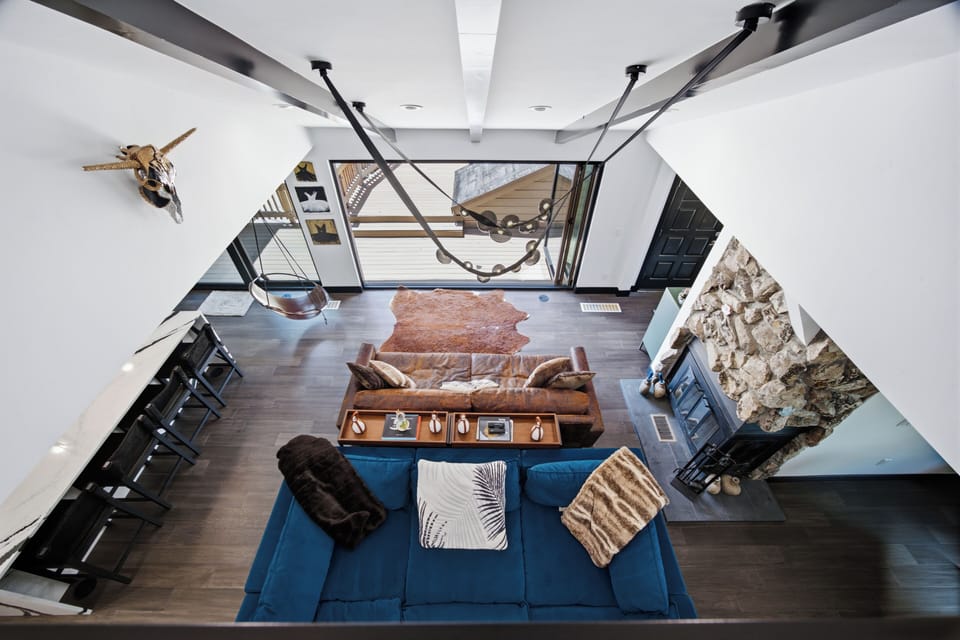 View from the loft of wood burning fireplace and living room