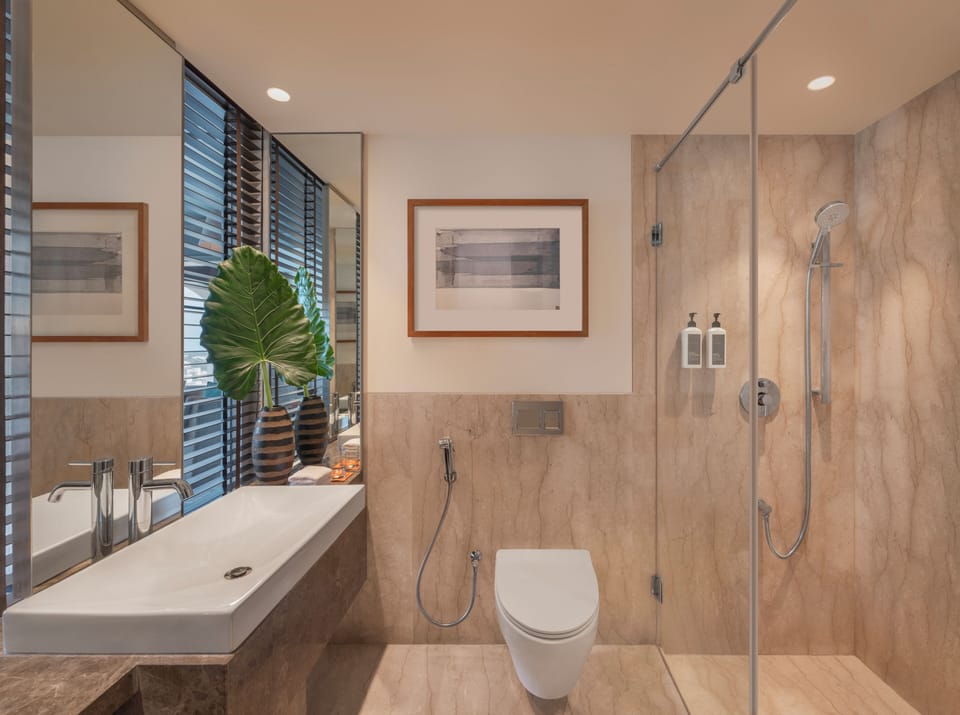 Shower, designer toiletries, bathrobes, slippers