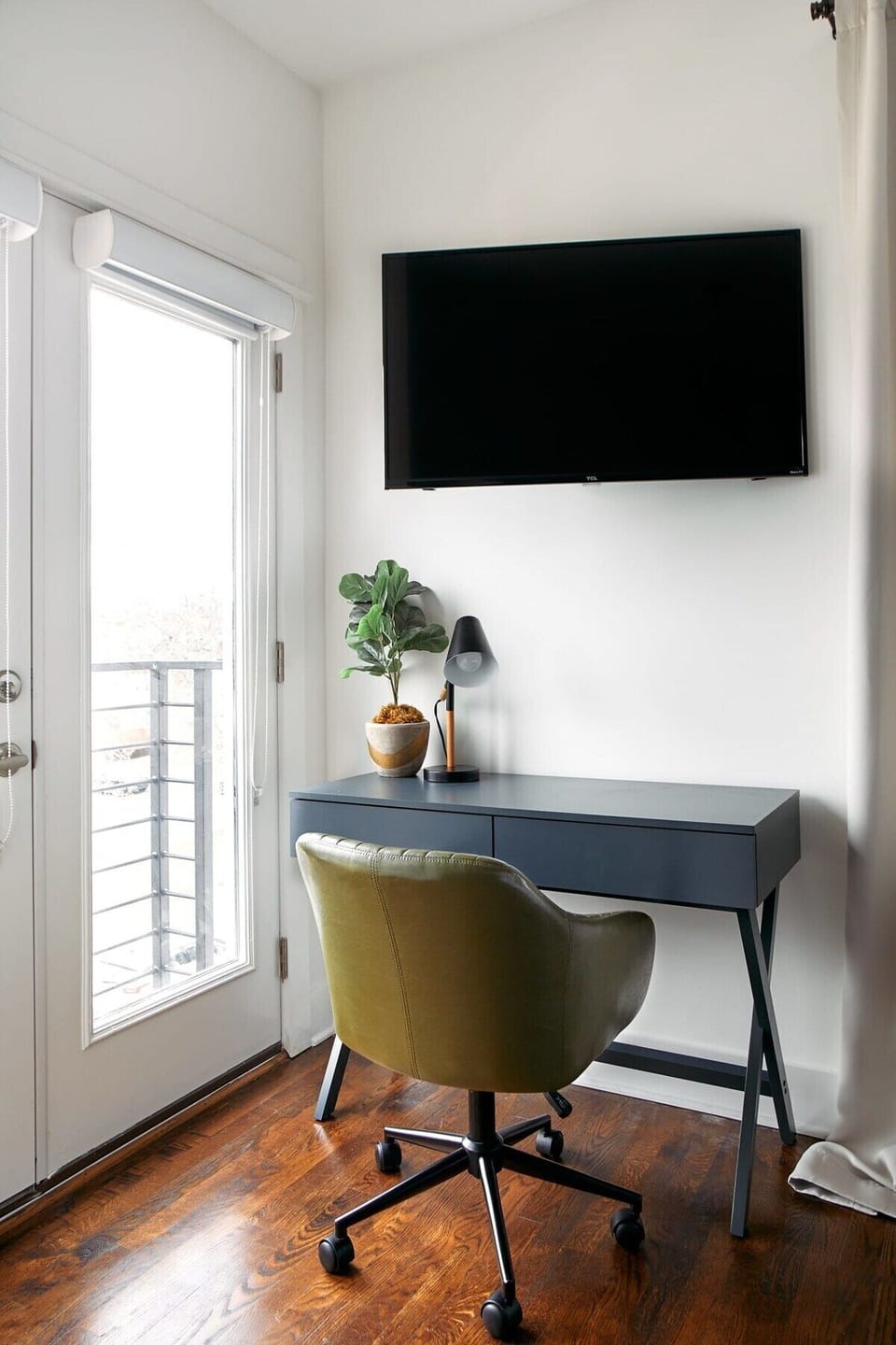 Settle in and get focused, this 3rd-floor bedroom corner is perfect for work and quiet moments.