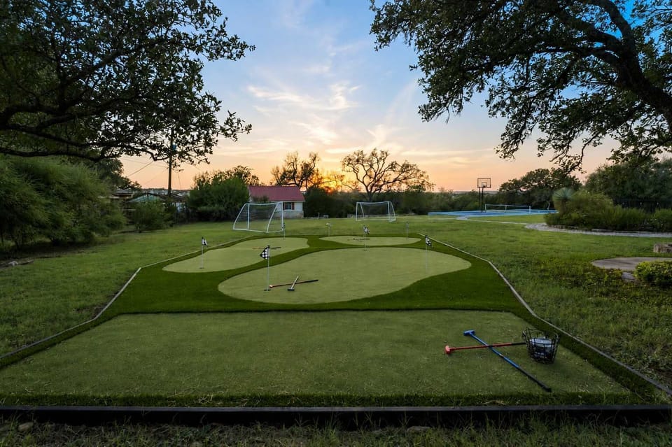 Practice your putt as the sun dips low — this backyard green makes golf part of the getaway.