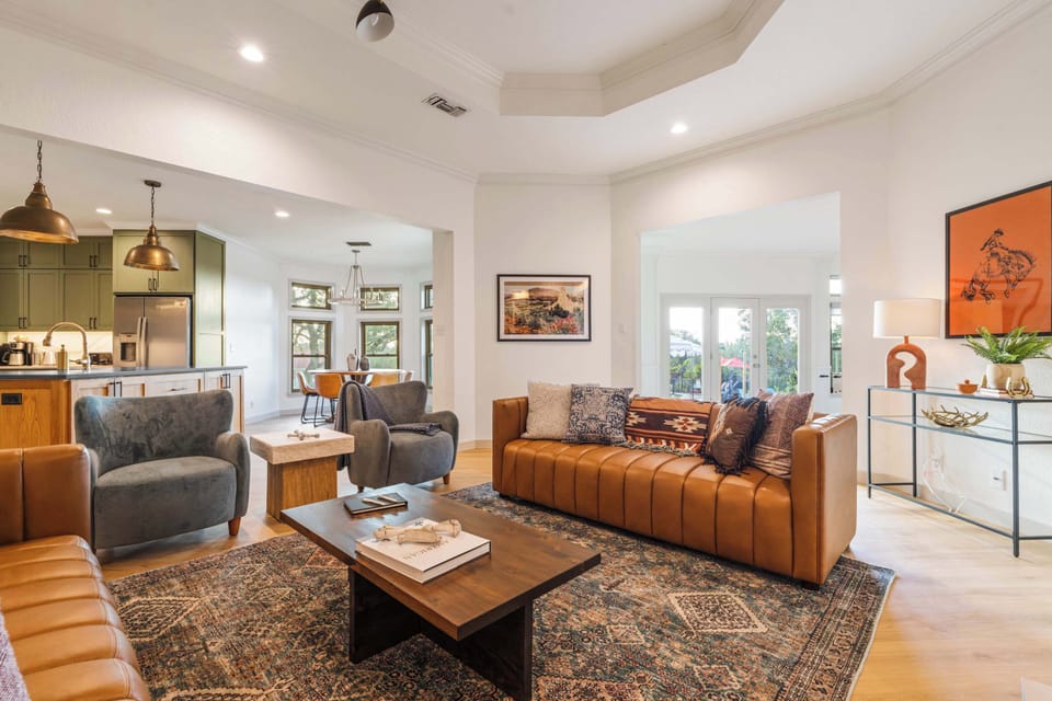 Gather in a light-filled living space that flows easily into the kitchen and dining area.