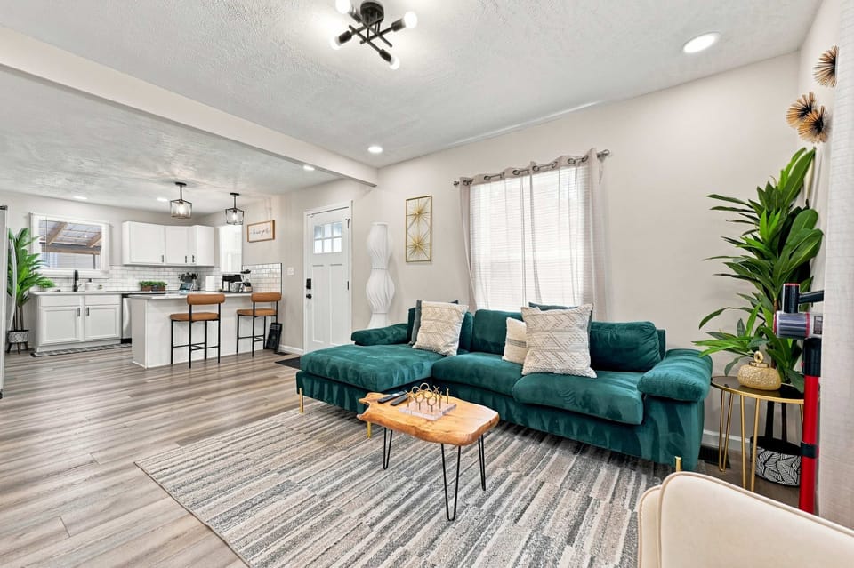 Open-concept living room keeps everyone connected to the kitchen and dining spaces