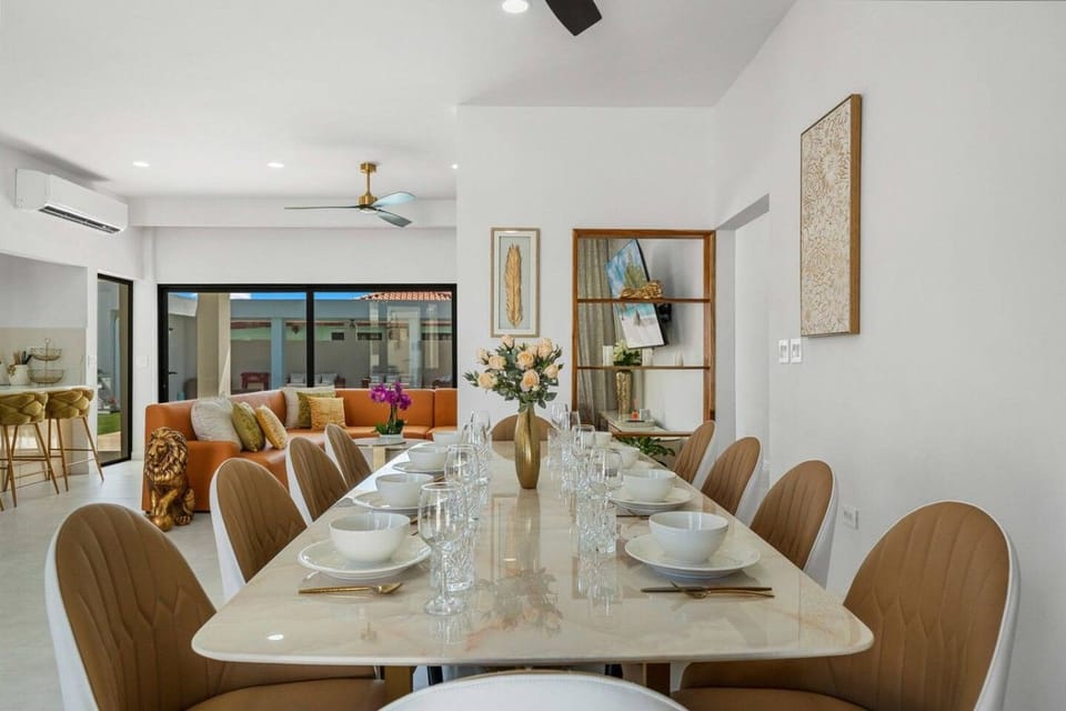 Gather for memorable meals in this bright and airy dining room, where the welcoming layout creates an easy setting for relaxed time together with family or friends
