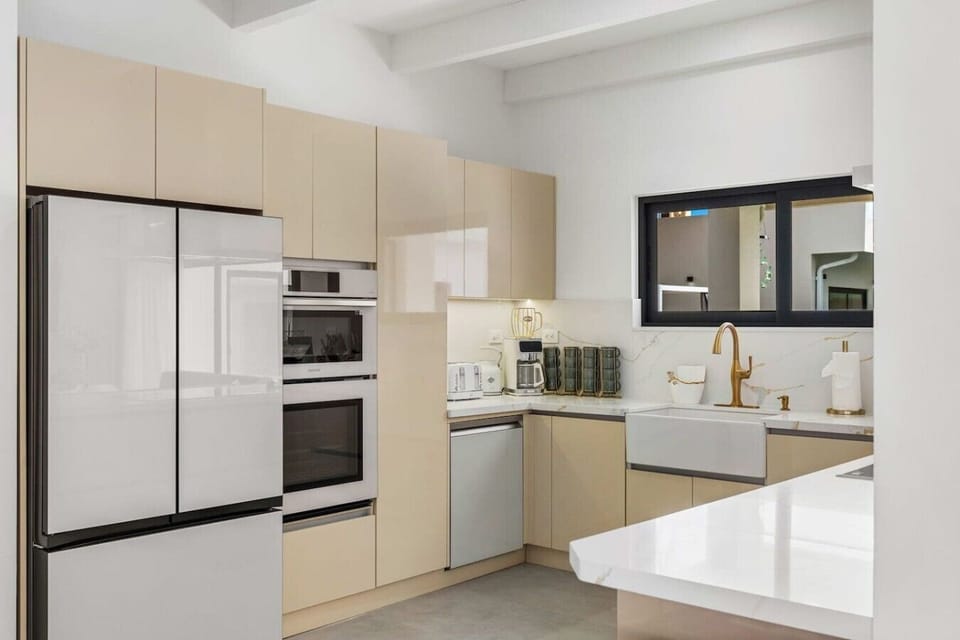 Create unforgettable meals in a beautifully designed kitchen featuring sleek finishes, abundant natural light, and a stylish space made for entertaining