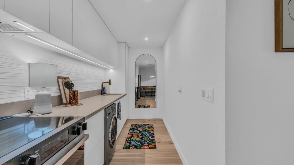 The sleek, eat-in kitchen with dining space for 4 is well equipped for an unforgettable getaway​