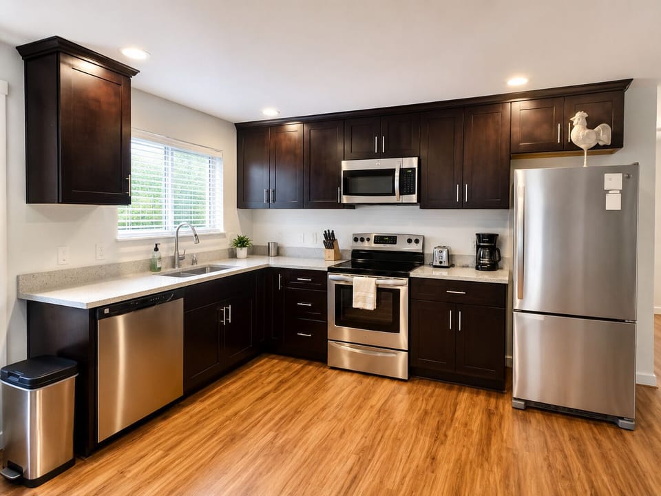 Bright laundry room with full-size washer, dryer, and handy storage