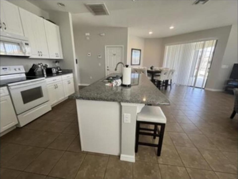 KITCHEN:  Fully Equipped Kitchen with Coffee Maker, Blender, Cookware, Dinnerware, Drinkware and Flatware