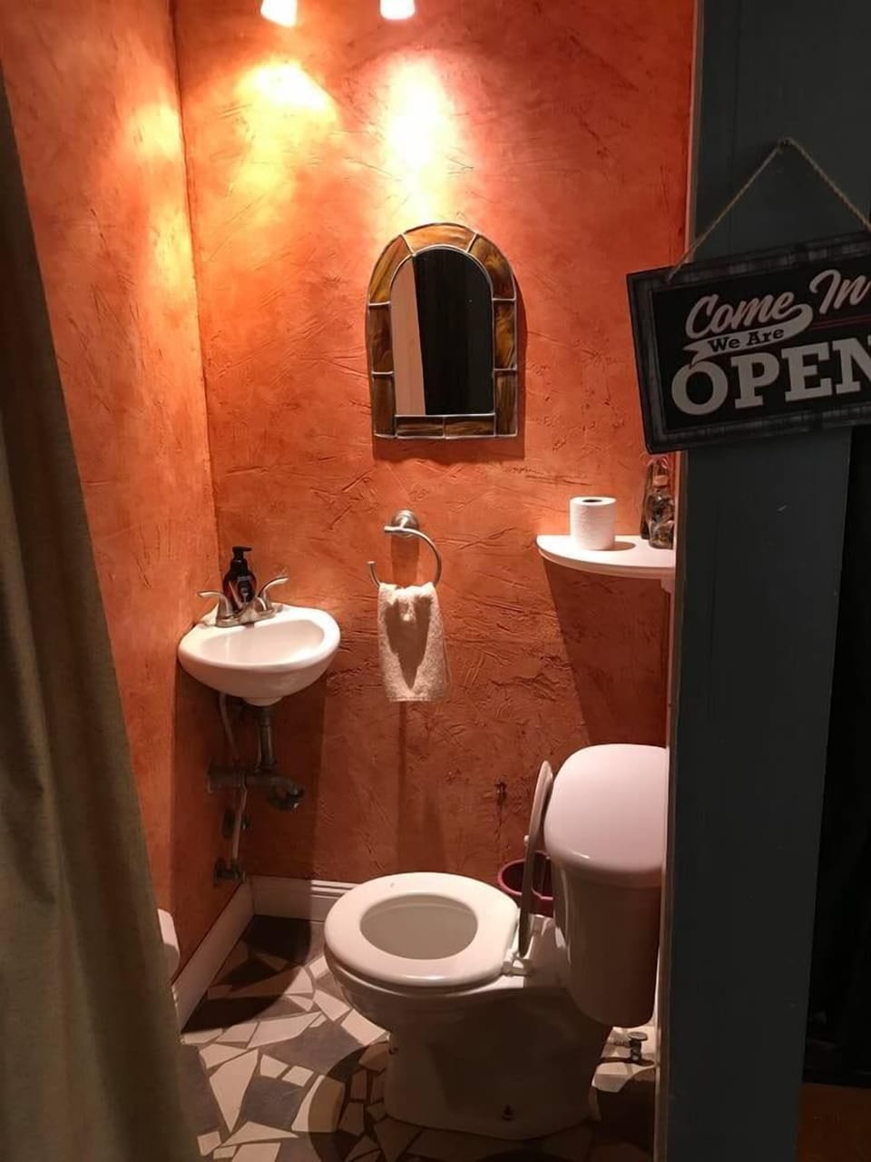 Half bath, off the kitchen and bunk room.