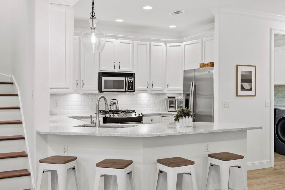 Open concept kitchen, dining and living area 