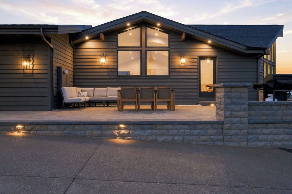 Dine al fresco or relax on the expansive patio while taking in the stunning evening glow over the trees.