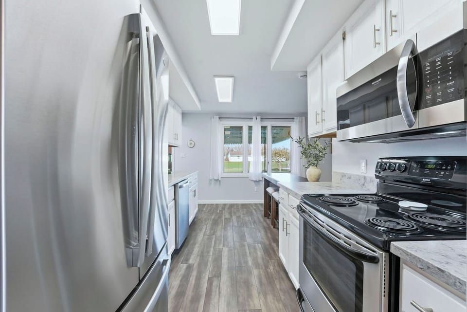 Pancake breakfast is a breeze in this modern kitchen, fully stocked with stainless appliances and an induction stovetop.