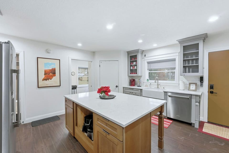 Your group will love hanging out in this renovated Fort Wayne kitchen featuring a deep farmhouse sink and plenty of storage for week-long stays.