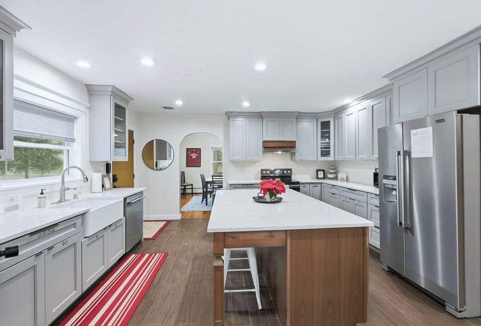 Prep large family meals at the quartz island in this fully equipped Fort Wayne kitchen which features stainless steel appliances and ample counter space.