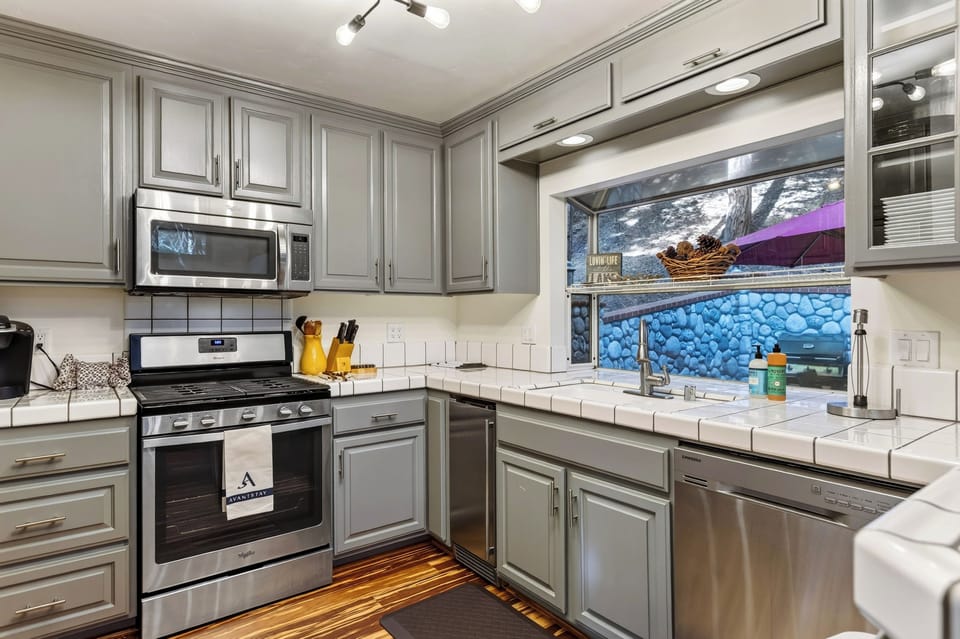 Kitchen with stainless steel appliances and ample cabinetry.